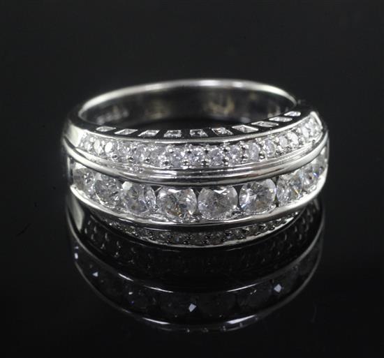 A modern 18ct white gold and triple row diamond half hoop dress ring, size Q.